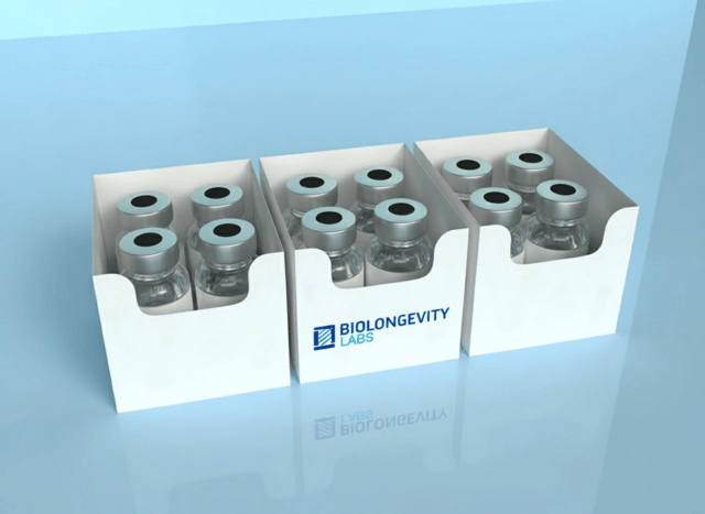Three boxes of research peptide vials ready for reconstitution in a laboratory.